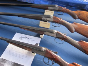 Fox shotguns at the Fox Collector's table. Check out that straight-gripped 20 gauge!