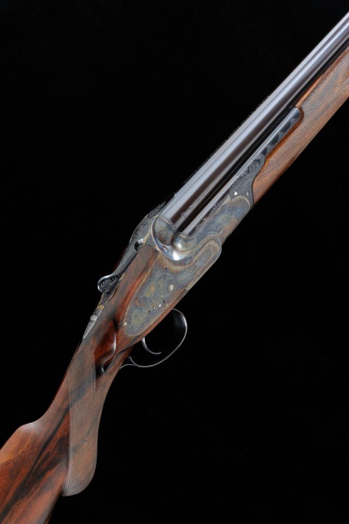 LOT 332: BOSS & CO. A FINE 12-BORE SINGLE TRIGGER SIDELOCK EJECTOR OVER AND UNDER GUN, NO. 9990